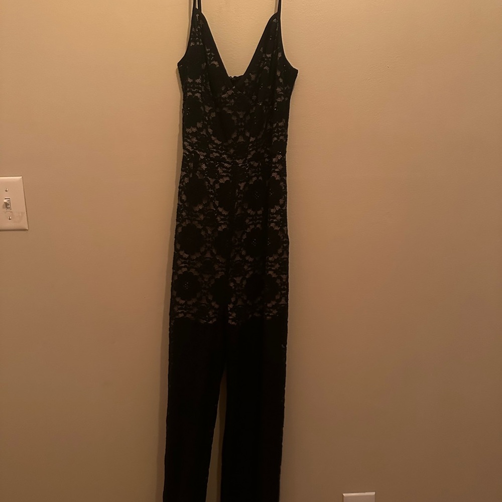 Sexy night out black lace jumpsuit. Sheer legs, nude bodice